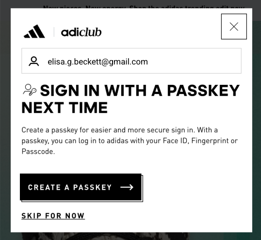 A 'Sign in with a passkey next time' prompt on the adidas website, encouraging users to create a passkey for faster and more secure sign-ins using biometrics or a passcode.